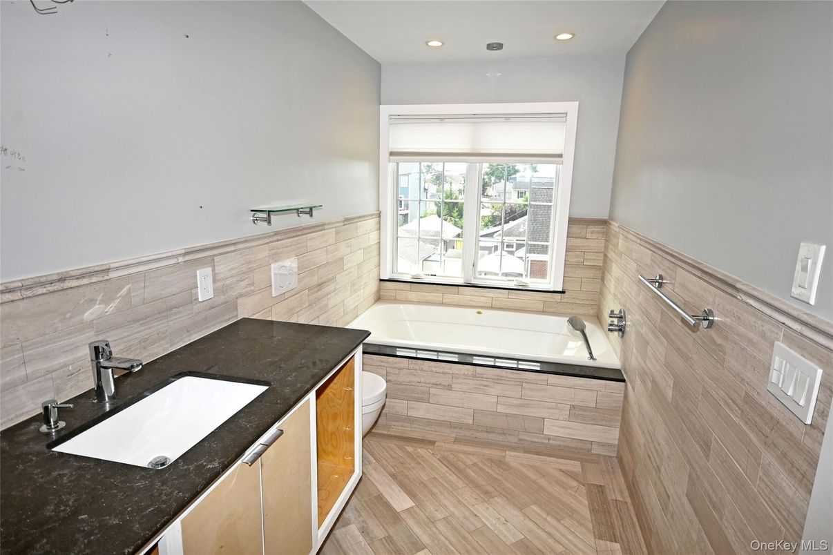 Bathroom, Dual Sink Vanities, Interior, Recessed Lighting, Wood Texture Flooring