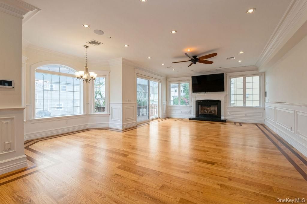 Chandelier, Empty room, Fireplace, Interior, Recessed Lighting, Wood Texture Flooring