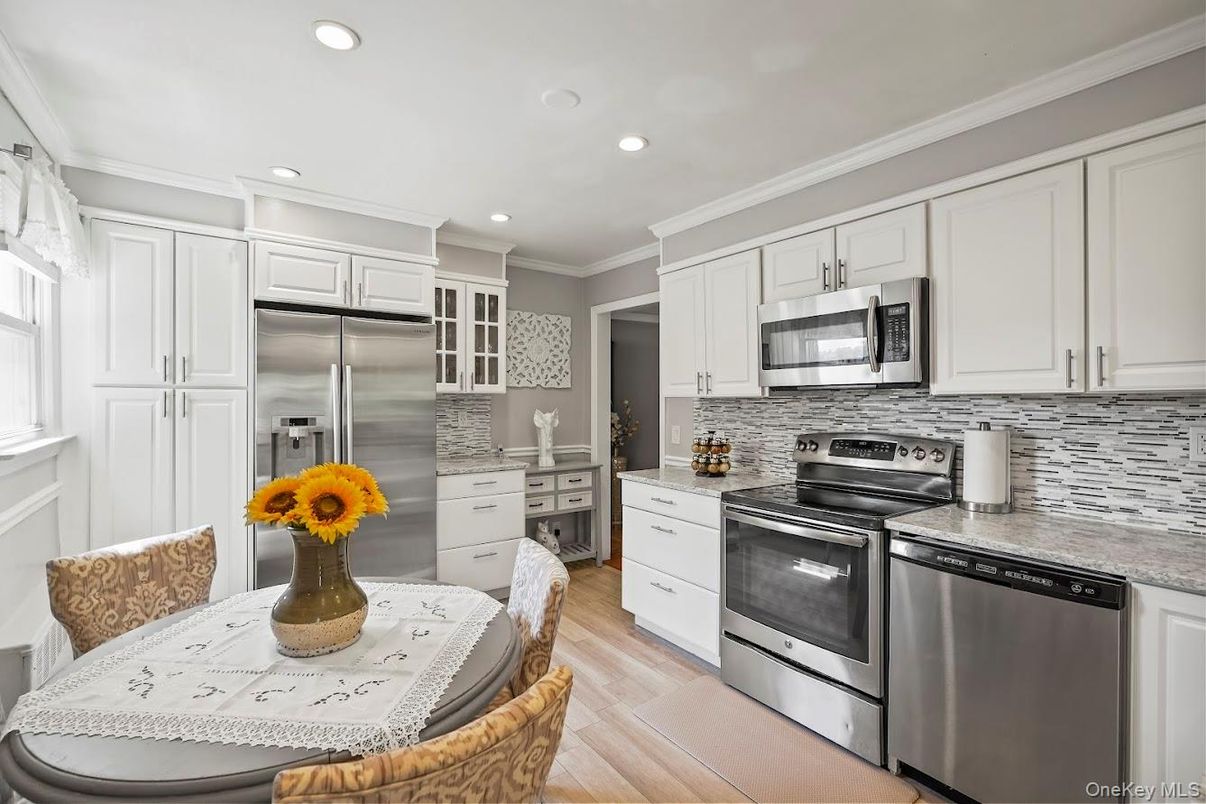 Dining room, Interior, Kitchen, Recessed Lighting, Stainless Steel Appliances, Wood Texture Flooring
