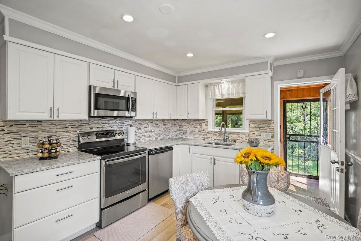 Dining room, Interior, Kitchen, Recessed Lighting, Stainless Steel Appliances, Wood Texture Flooring