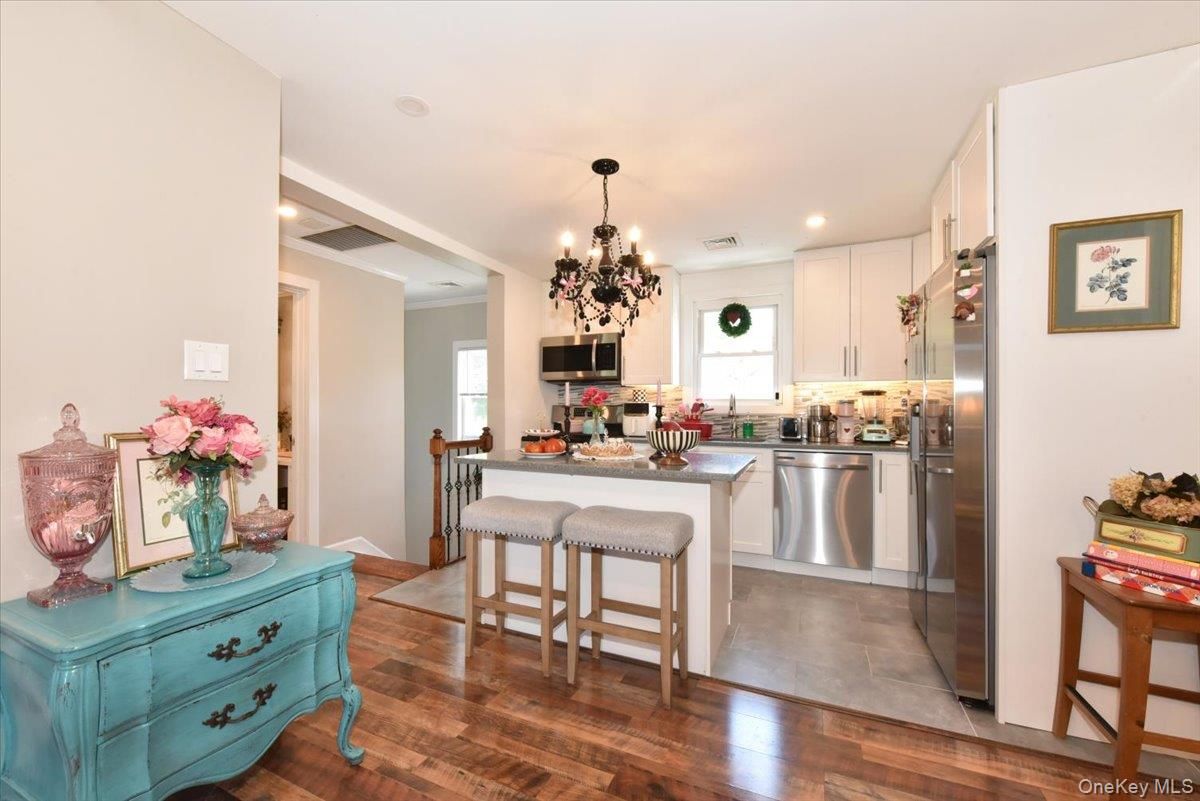 Chandelier, Dining room, Interior, Kitchen, Recessed Lighting, Stainless Steel Appliances, Wood Texture Flooring