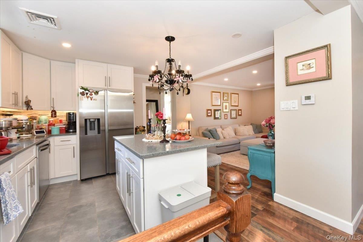 Chandelier, Interior, Kitchen, Living room, Recessed Lighting, Stainless Steel Appliances, Wood Texture Flooring