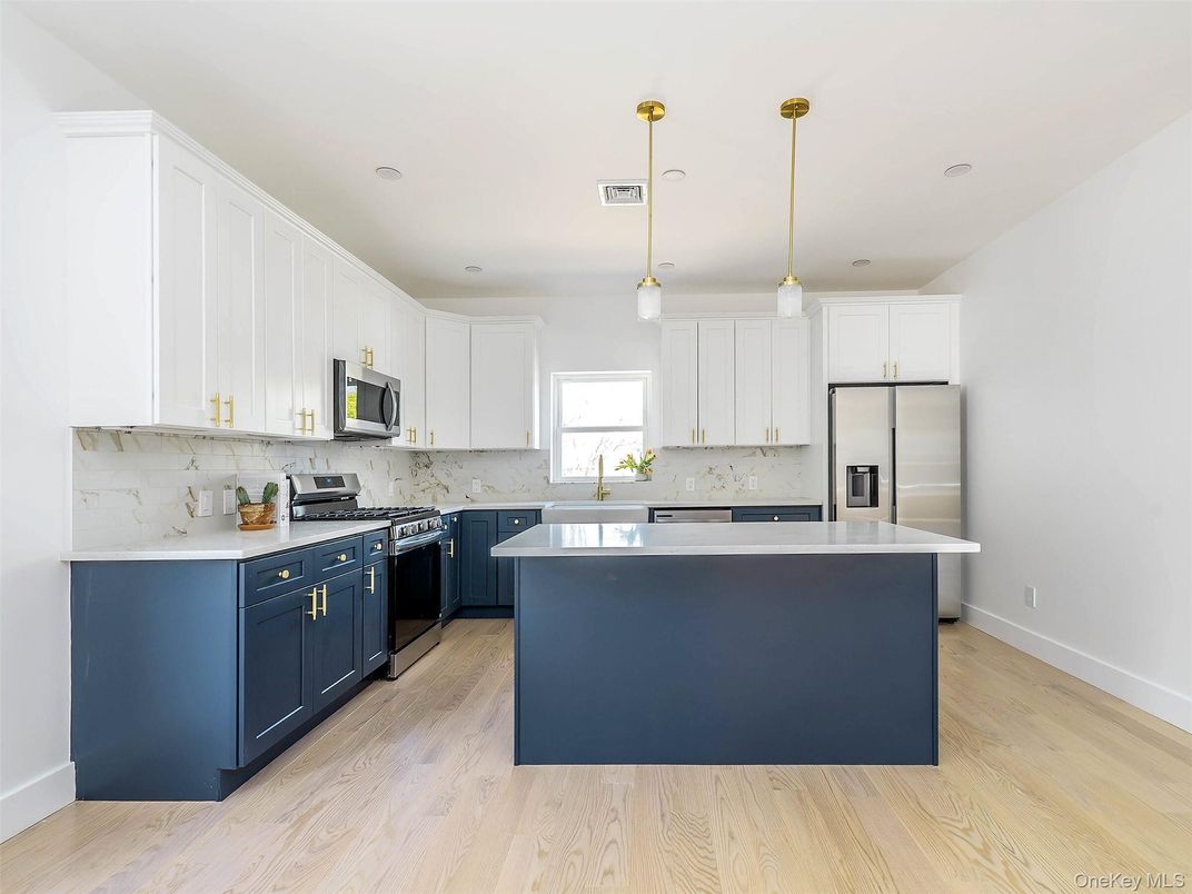 Interior, Kitchen, Marble Walls, Pendant Lights, Recessed Lighting, Stainless Steel Appliances, Wood Texture Flooring