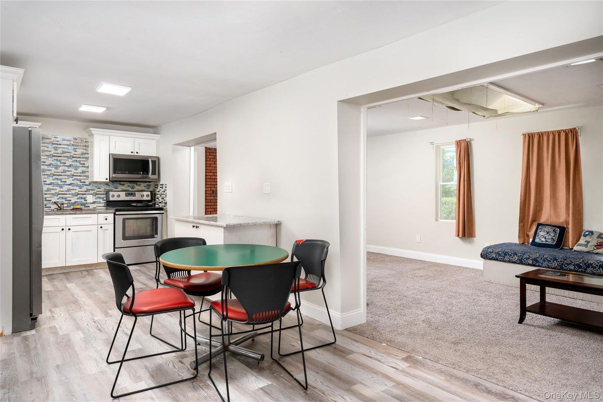 Dining room, Interior, Kitchen, Recessed Lighting, Stainless Steel Appliances, Wood Texture Flooring