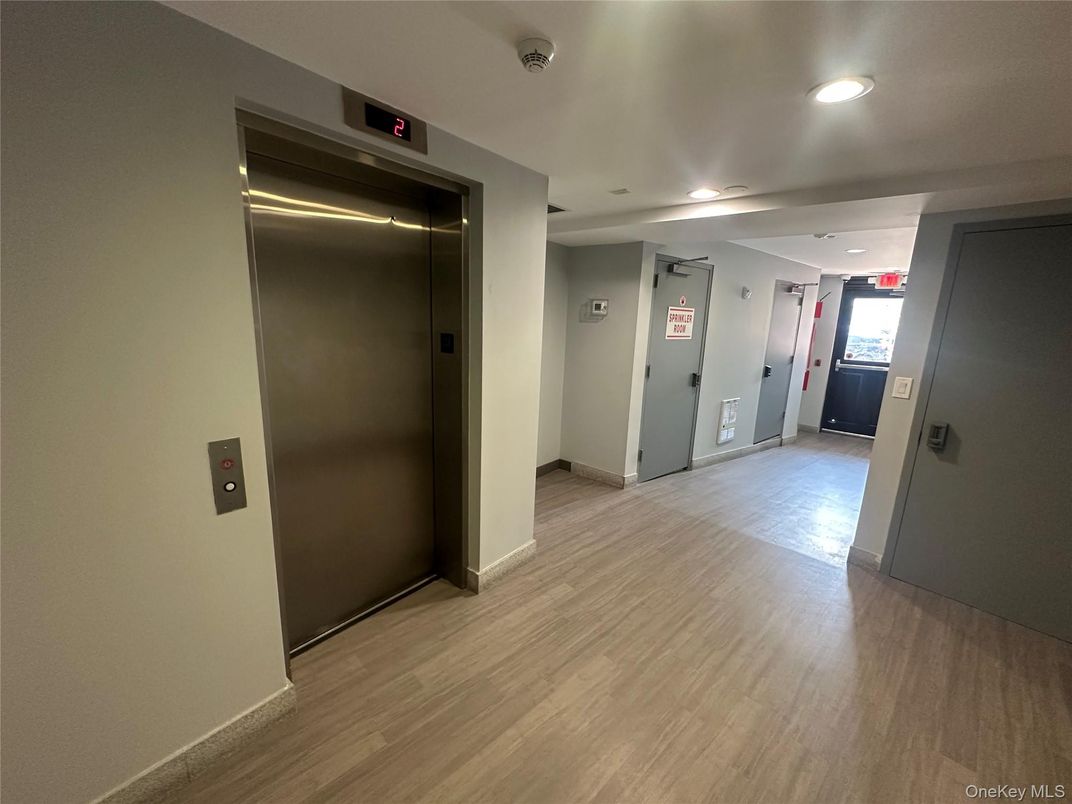 Elevator, Interior, Recessed Lighting, Wood Texture Flooring
