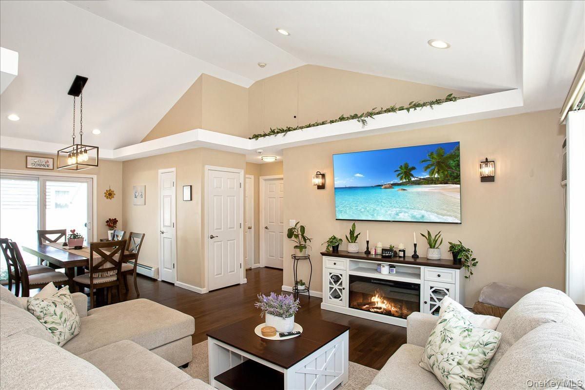 Dining room, Fireplace, Interior, Living room, Pendant Lights, Recessed Lighting, Wood Texture Flooring