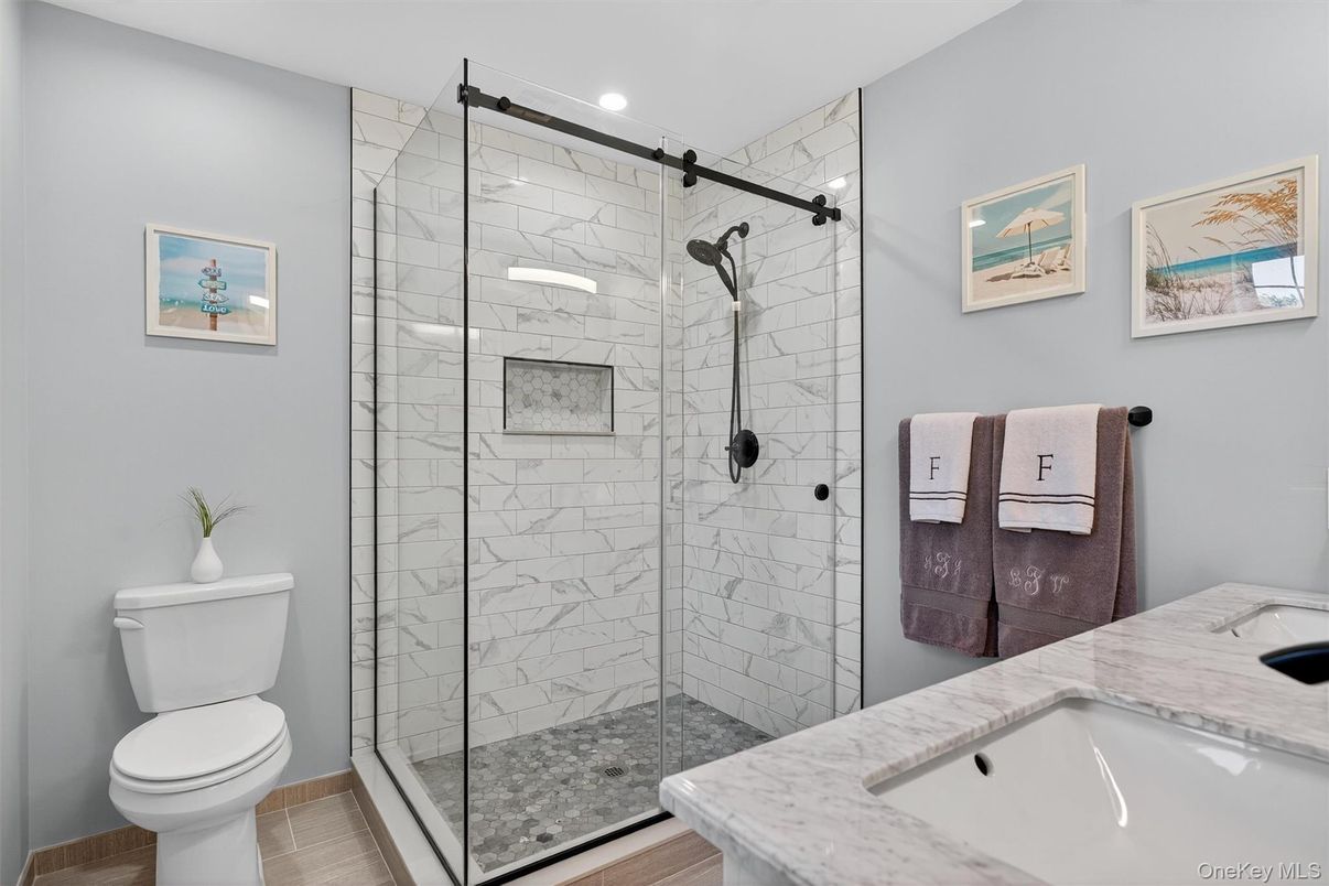 Bathroom, Glass Shower, Interior, Marble Walls, Recessed Lighting, Wood Texture Flooring