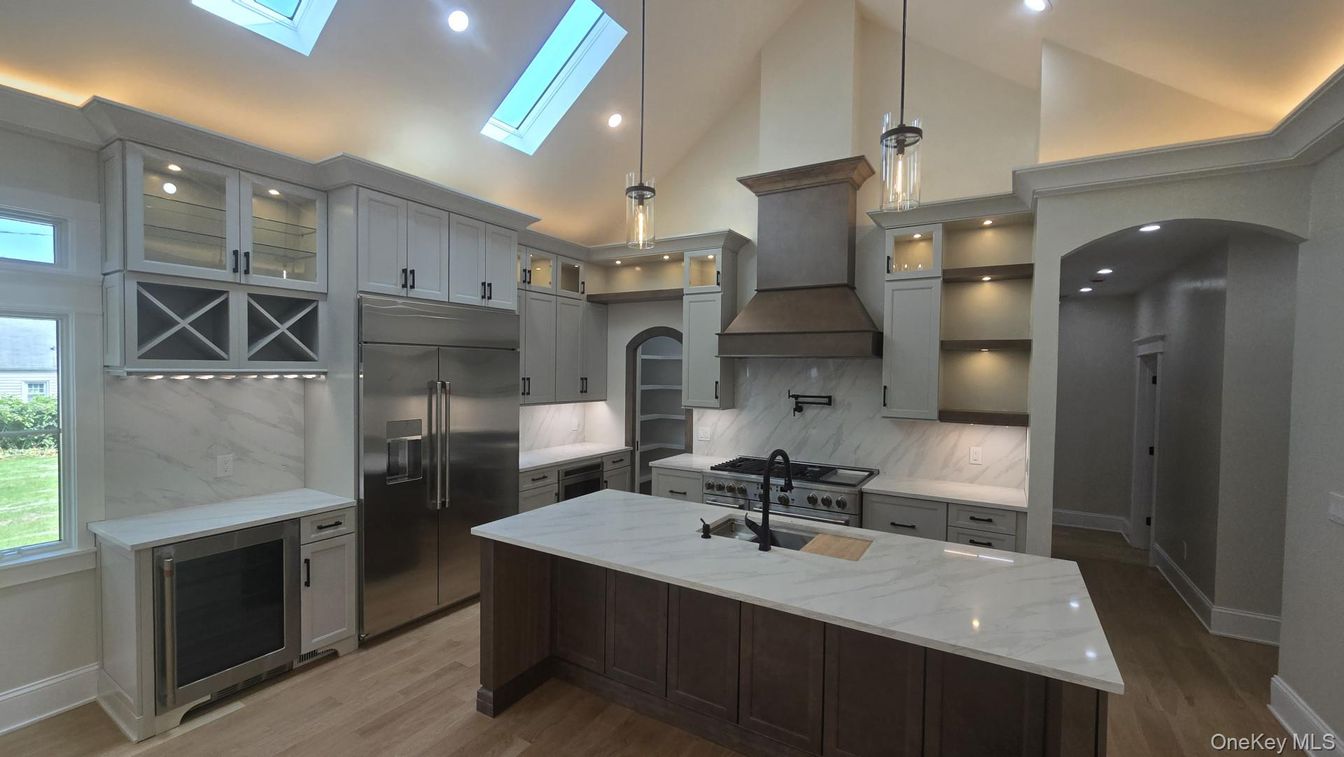 Interior, Kitchen, Marble Walls, Pendant Lights, Recessed Lighting, Stainless Steel Appliances, Wood Texture Flooring