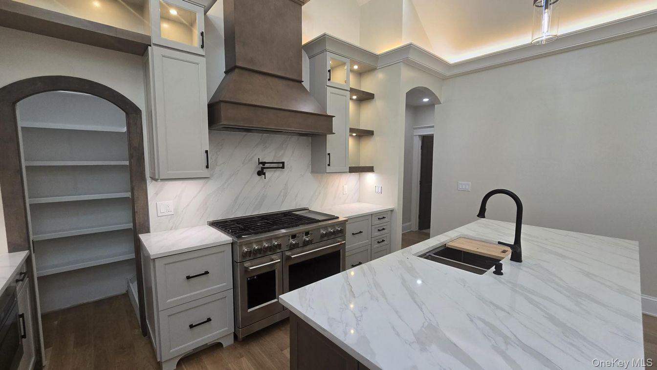 Interior, Kitchen, Marble Walls, Recessed Lighting, Stainless Steel Appliances, Wood Texture Flooring