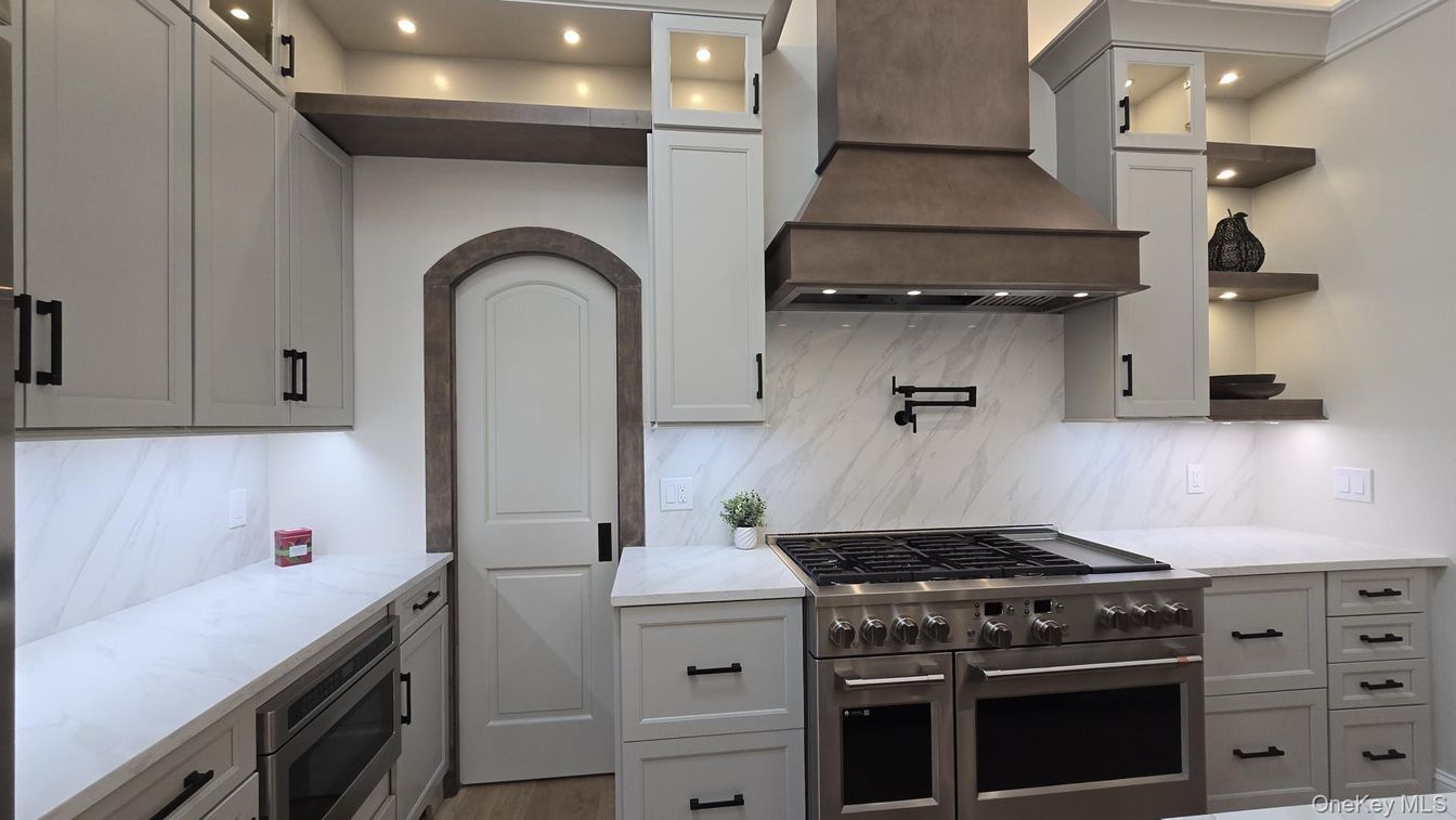 Interior, Kitchen, Marble Walls, Recessed Lighting, Stainless Steel Appliances, Wood Texture Flooring