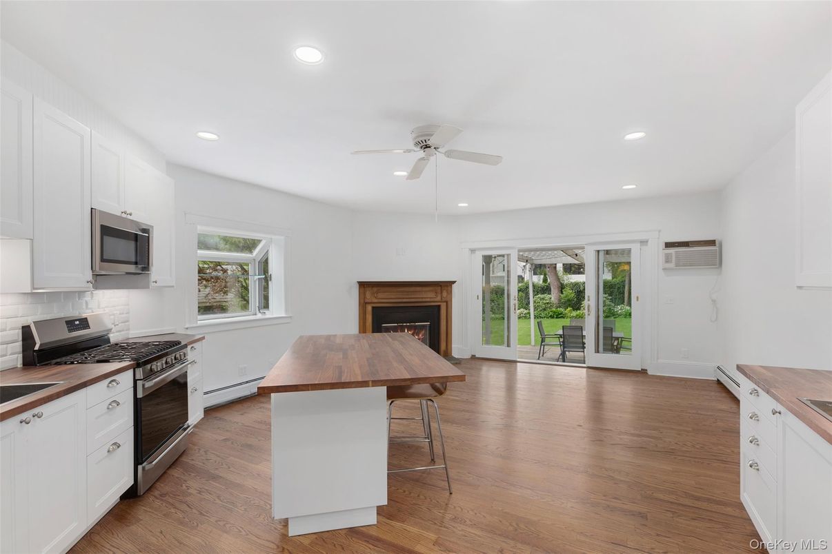 Fireplace, Interior, Kitchen, Recessed Lighting, Wood Texture Flooring