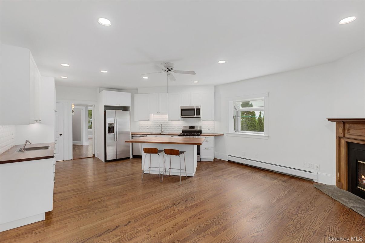 Fireplace, Interior, Kitchen, Recessed Lighting, Stainless Steel Appliances, Wood Texture Flooring