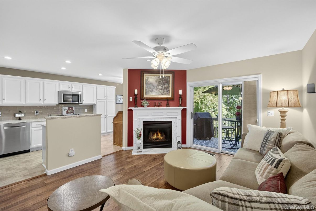 Fireplace, Interior, Kitchen, Living room, Recessed Lighting, Stainless Steel Appliances, Wood Texture Flooring