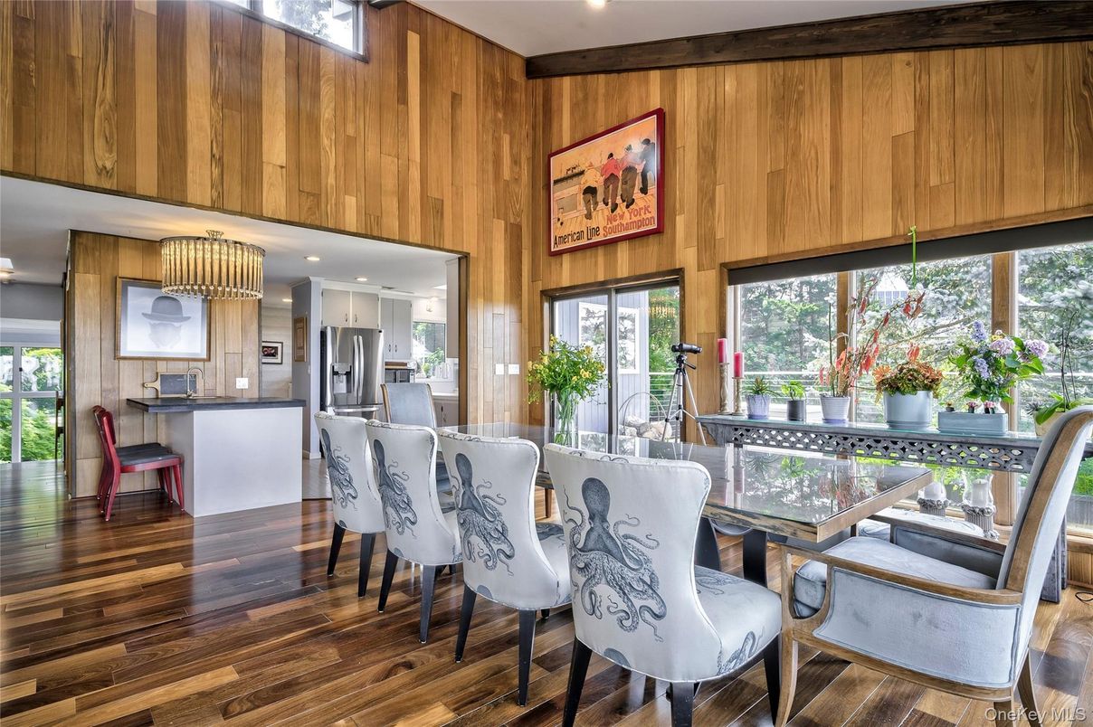 Chandelier, Dining room, Interior, Kitchen, Recessed Lighting, Stainless Steel Appliances, Wood Texture Flooring, Wooden Walls