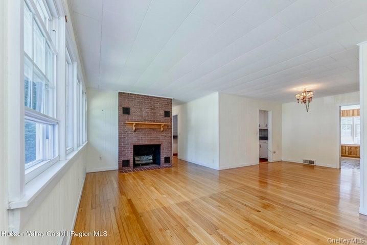 Chandelier, Empty room, Fireplace, Interior, Stone Walls, Wood Texture Flooring