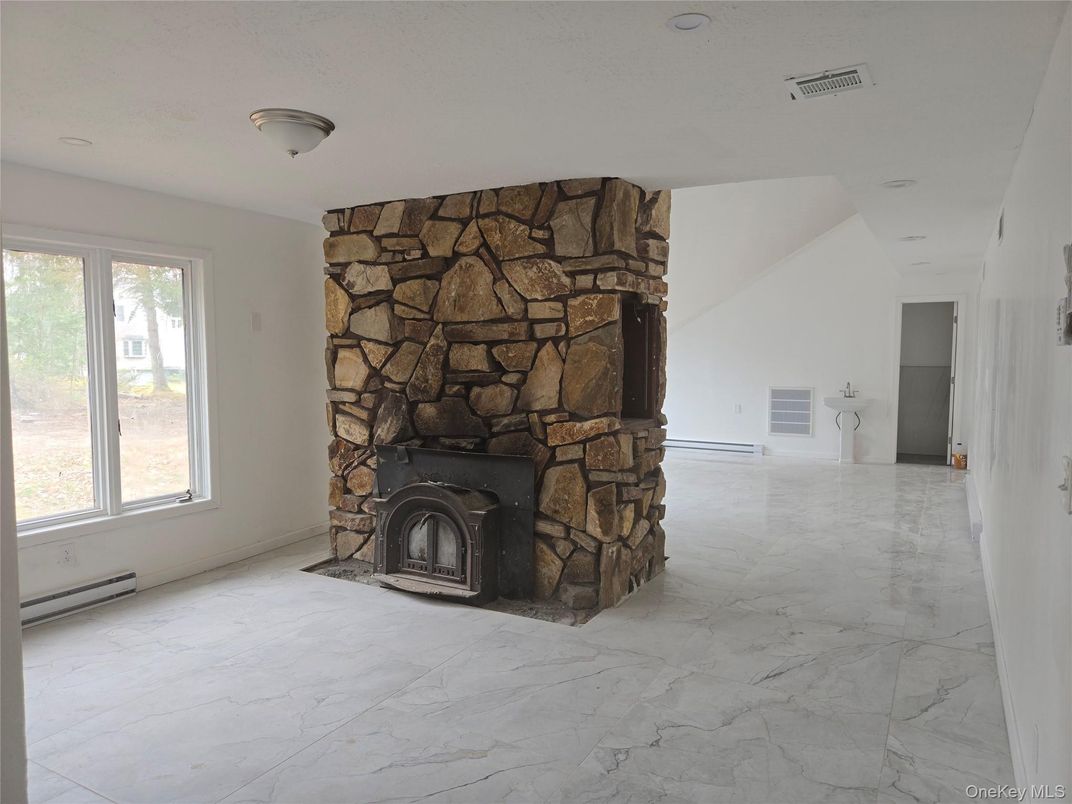 Empty room, Fireplace, Interior, Marble, Recessed Lighting, Stone Walls