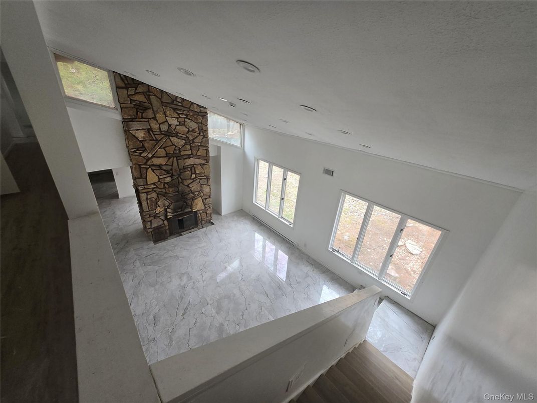Empty room, Fireplace, Interior, Marble, Recessed Lighting, Stone Walls