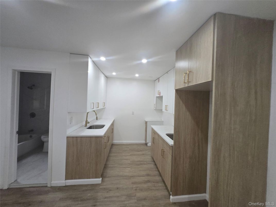 Bathroom, Dual Sink Vanities, Interior, Recessed Lighting, Wood Texture Flooring