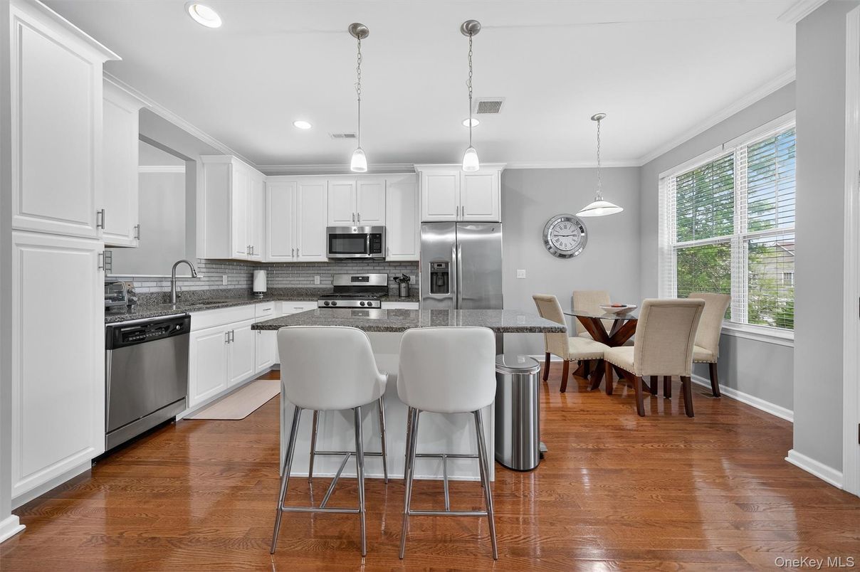Dining room, Interior, Kitchen, Pendant Lights, Recessed Lighting, Stainless Steel Appliances, Wood Texture Flooring