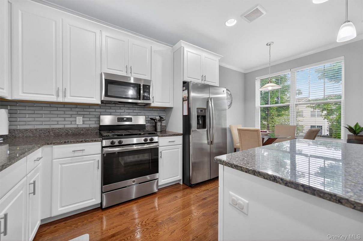 Dining room, Interior, Kitchen, Pendant Lights, Recessed Lighting, Stainless Steel Appliances, Wood Texture Flooring