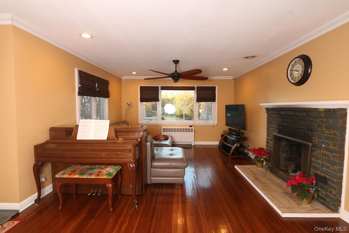 Fireplace, Interior, Piano, Recessed Lighting, Wood Texture Flooring