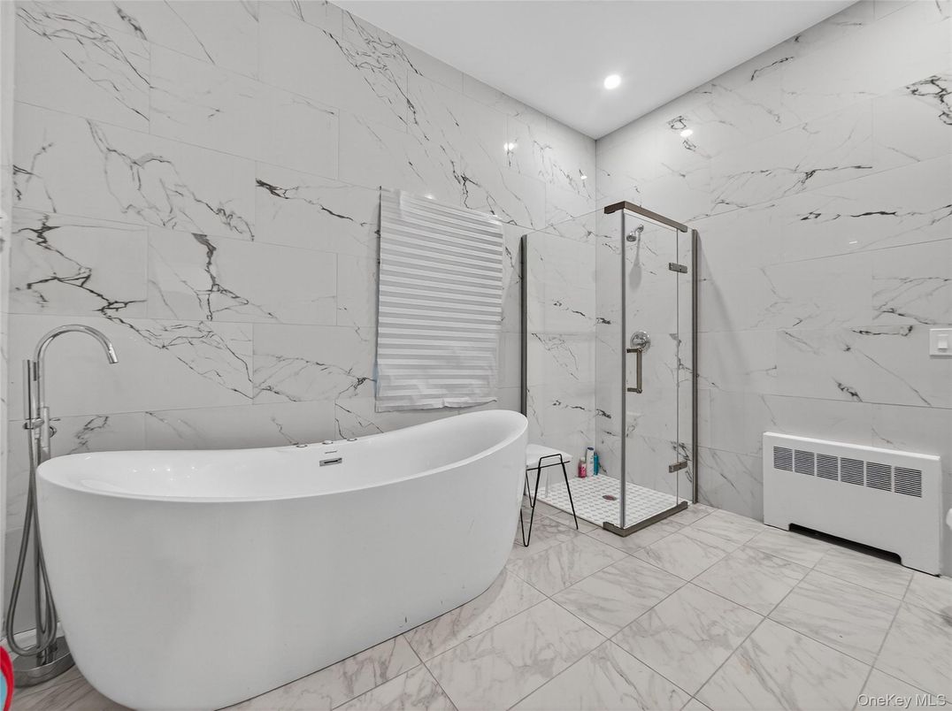 Bathroom, Free Standing Baths, Glass Shower, Interior, Marble, Marble Walls, Recessed Lighting