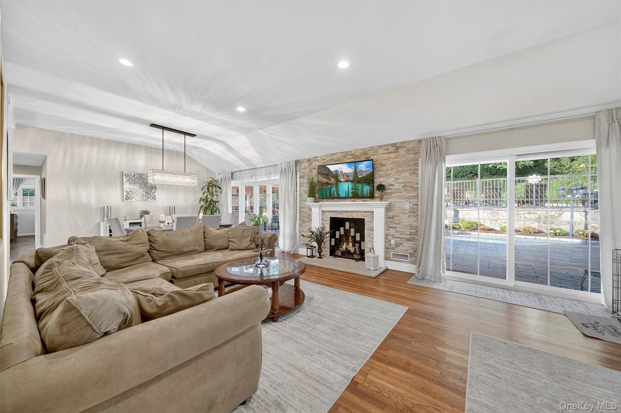 Dining room, Fireplace, Interior, Living room, Pendant Lights, Recessed Lighting, Stone Walls, Wood Texture Flooring