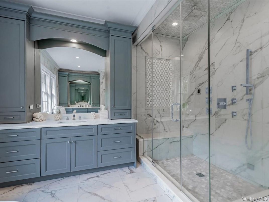 Bathroom, Dual Sink Vanities, Glass Shower, Interior, Marble, Marble Walls, Recessed Lighting