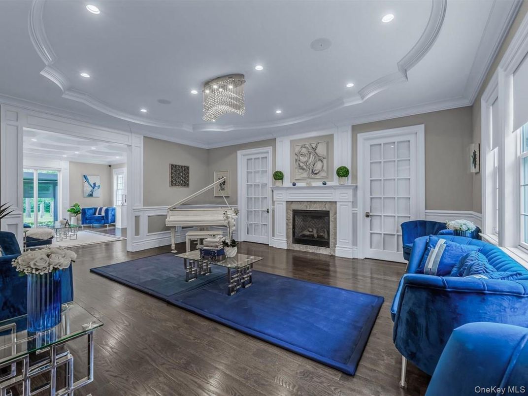 Chandelier, Fireplace, Interior, Living room, Piano, Recessed Lighting, Wood Texture Flooring