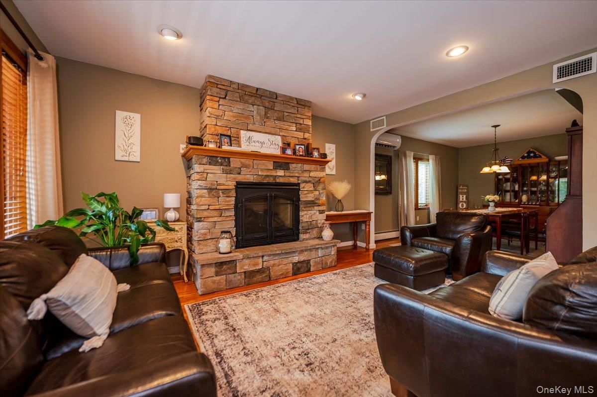 Dining room, Fireplace, Interior, Living room, Pendant Lights, Recessed Lighting, Stone Walls, Wood Texture Flooring