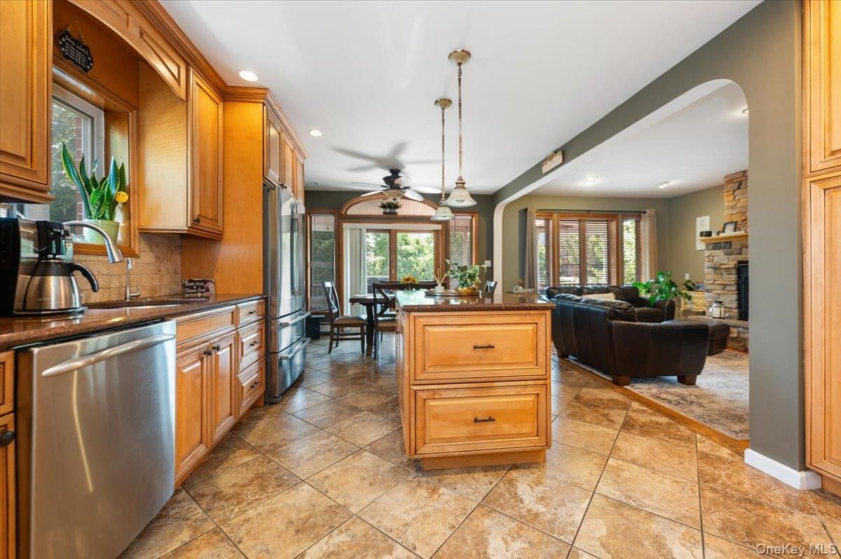 Dining room, Fireplace, Interior, Kitchen, Living room, Pendant Lights, Recessed Lighting, Stainless Steel Appliances, Stone Walls