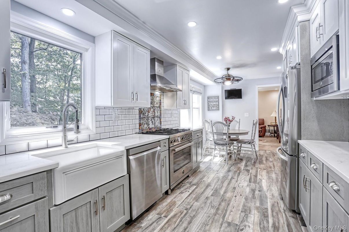 Dining room, Interior, Kitchen, Recessed Lighting, Stainless Steel Appliances, Wood Texture Flooring