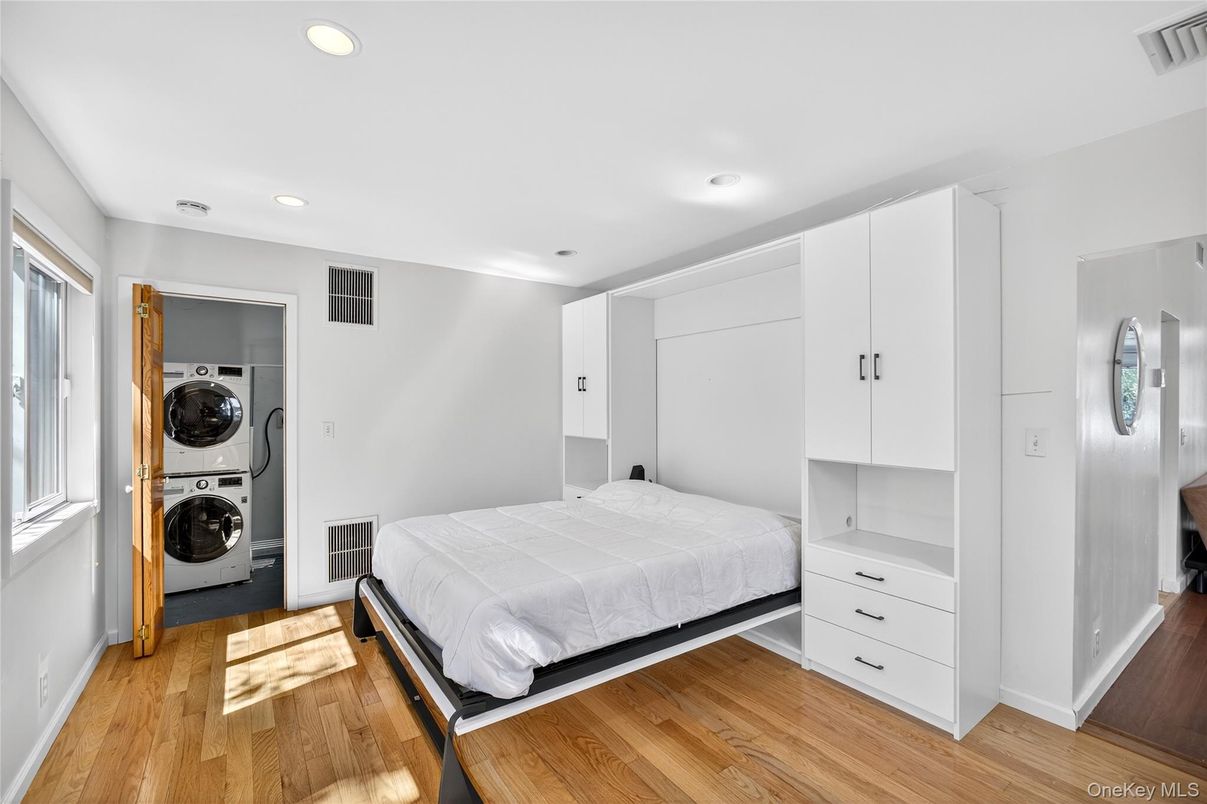 Bedroom, Interior, Recessed Lighting, Utility Closets, Washer, Wood Texture Flooring