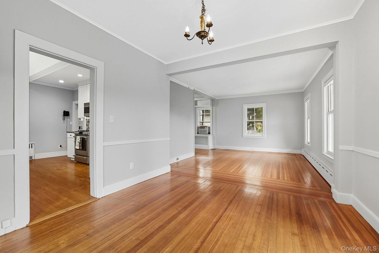 Chandelier, Empty room, Interior, Kitchen, Recessed Lighting, Stainless Steel Appliances, Wood Texture Flooring
