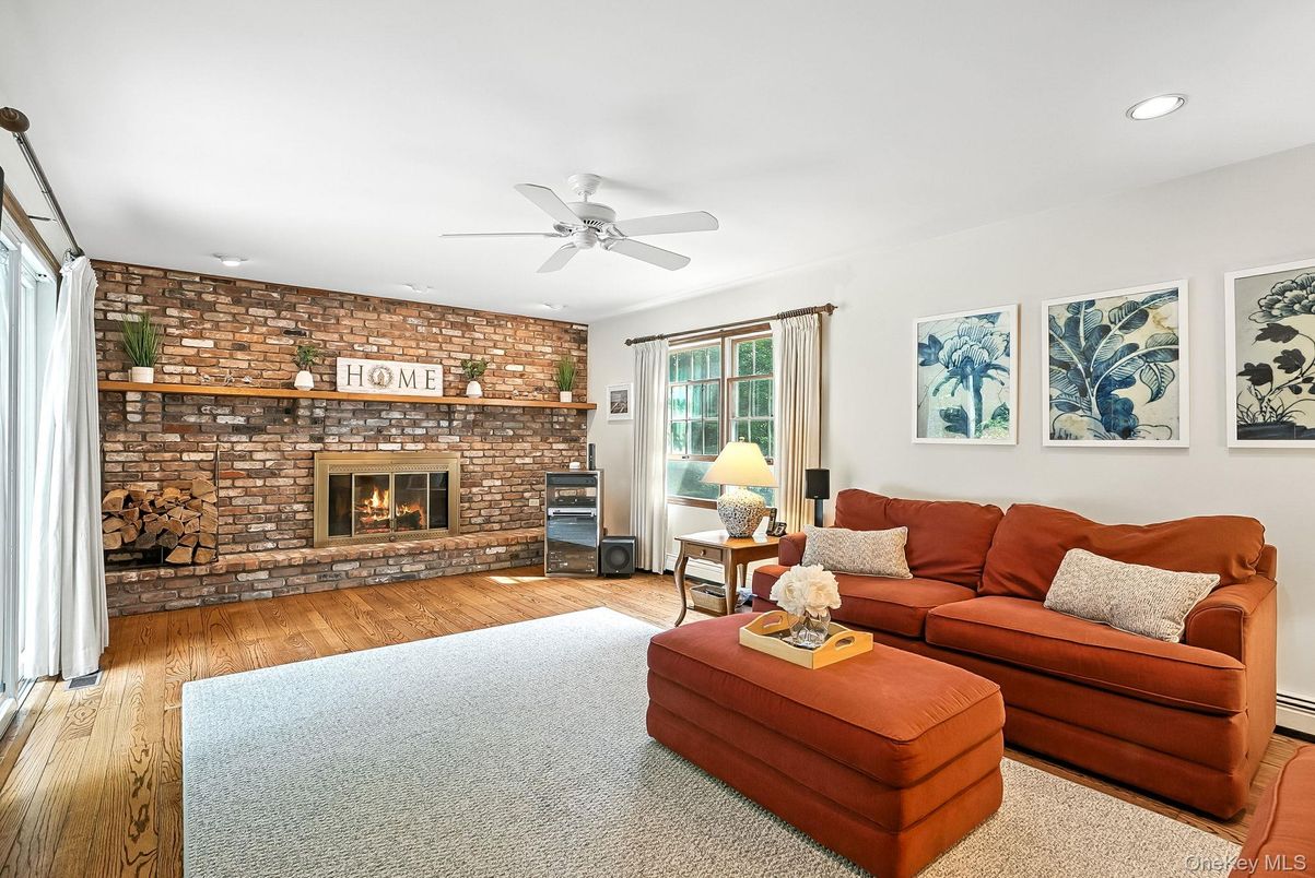 Fireplace, Interior, Living room, Recessed Lighting, Stone Walls, Wood Texture Flooring