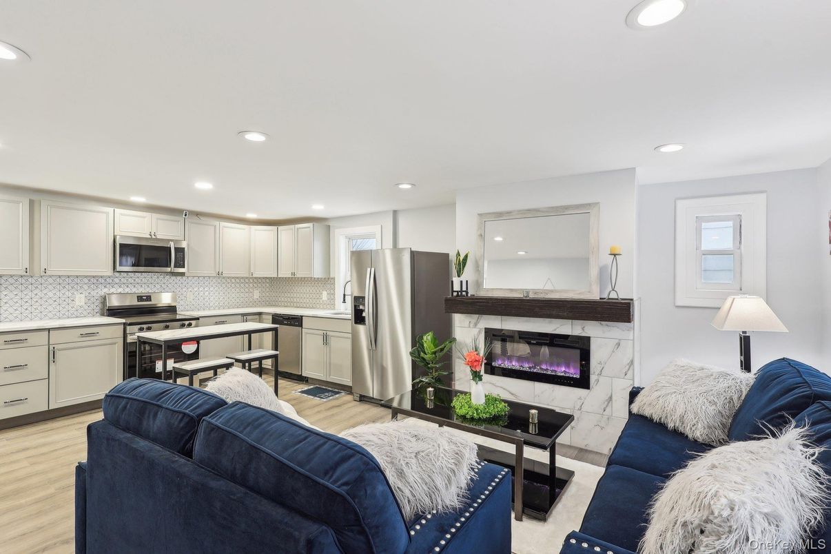Fireplace, Interior, Kitchen, Living room, Recessed Lighting, Stainless Steel Appliances, Wood Texture Flooring