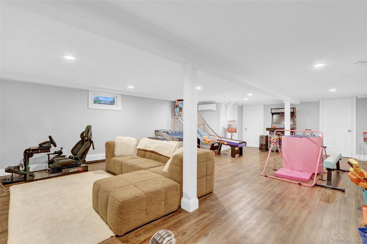 Fitness Equipment, Game Room, Interior, Living room, Recessed Lighting, Wood Texture Flooring
