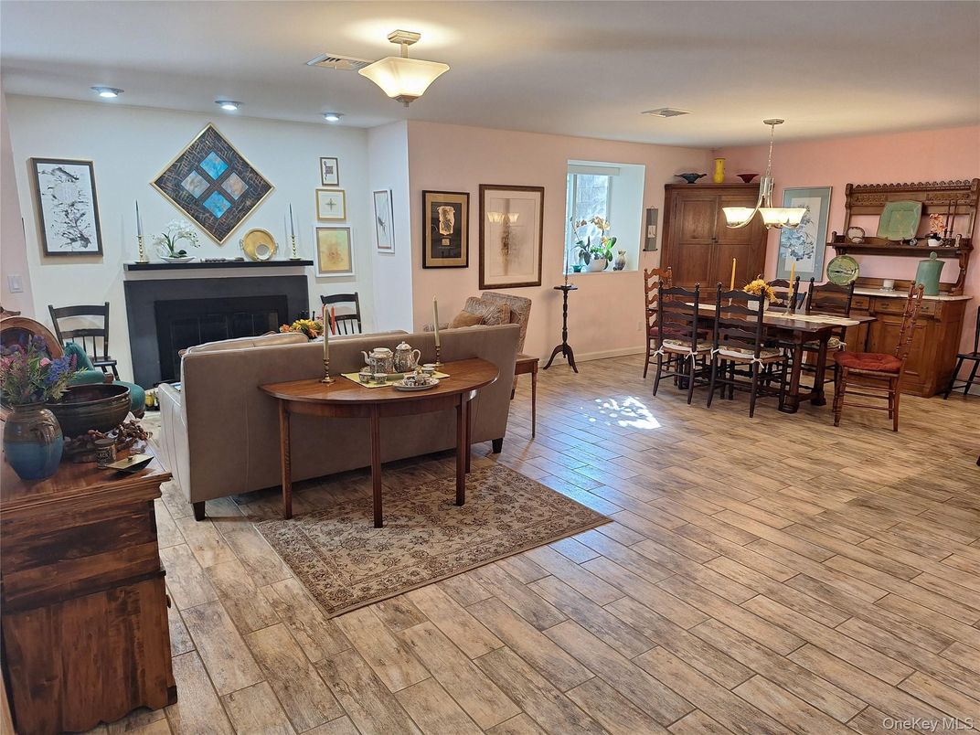Dining room, Fireplace, Interior, Living room, Pendant Lights, Recessed Lighting, Wood Texture Flooring