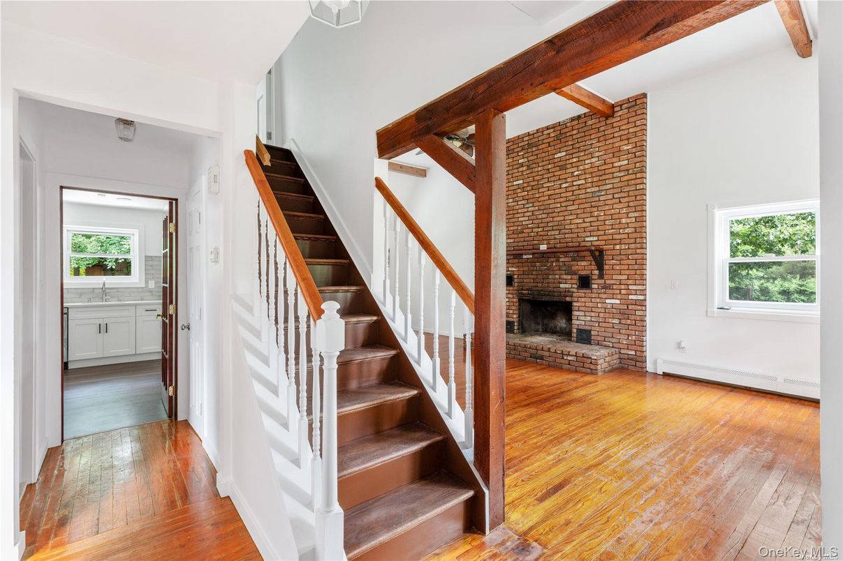 Empty room, Fireplace, Interior, Stone Walls, Wooden Beams, Wood Texture Flooring