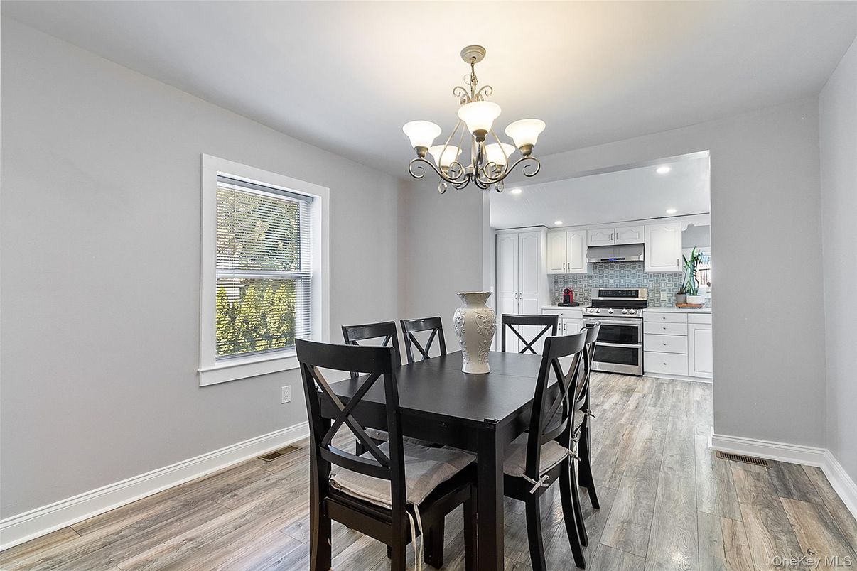 Chandelier, Dining room, Interior, Kitchen, Recessed Lighting, Stainless Steel Appliances, Wood Texture Flooring