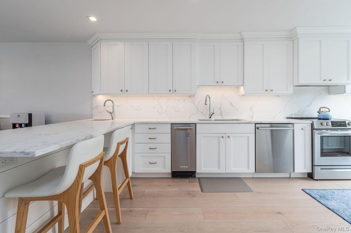Interior, Kitchen, Marble Walls, Recessed Lighting, Stainless Steel Appliances, Wood Texture Flooring