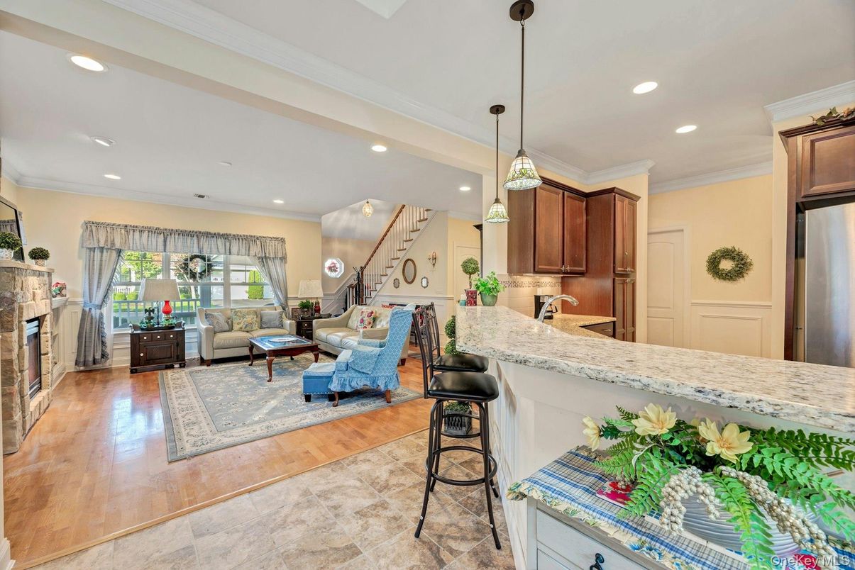 Fireplace, Interior, Kitchen, Living room, Pendant Lights, Recessed Lighting, Stainless Steel Appliances, Wood Texture Flooring