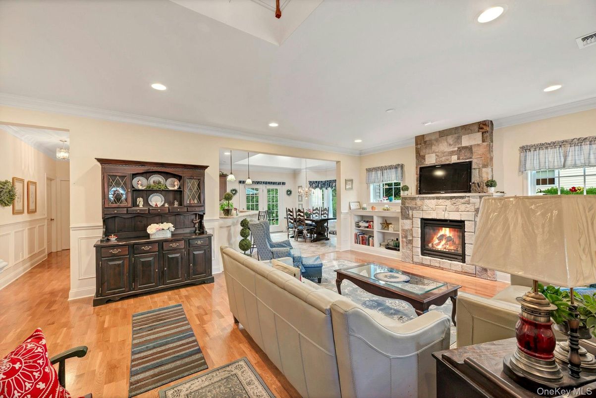 Dining room, Fireplace, Interior, Living room, Pendant Lights, Recessed Lighting, Stone Walls, Wood Texture Flooring