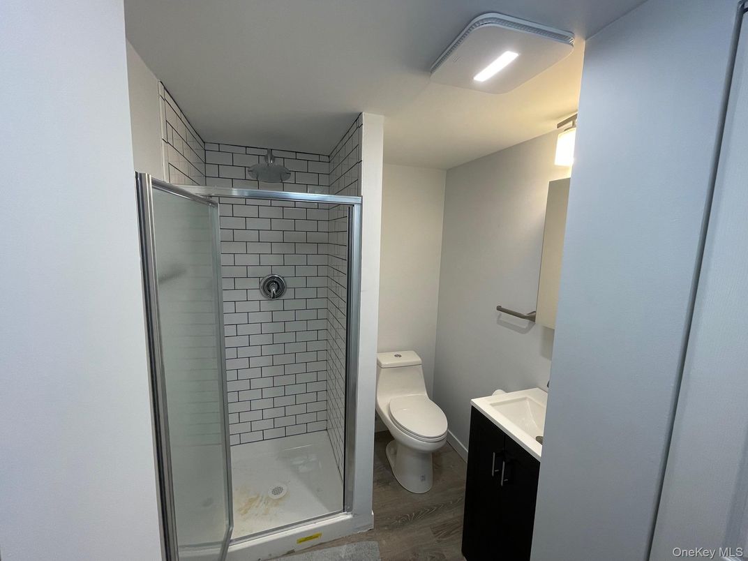 Bathroom, Glass Shower, Interior, Recessed Lighting, Wood Texture Flooring
