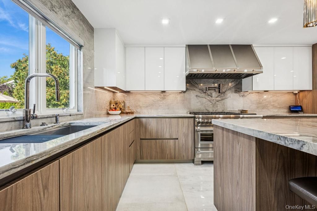 Interior, Kitchen, Marble Walls, Recessed Lighting, Stainless Steel Appliances