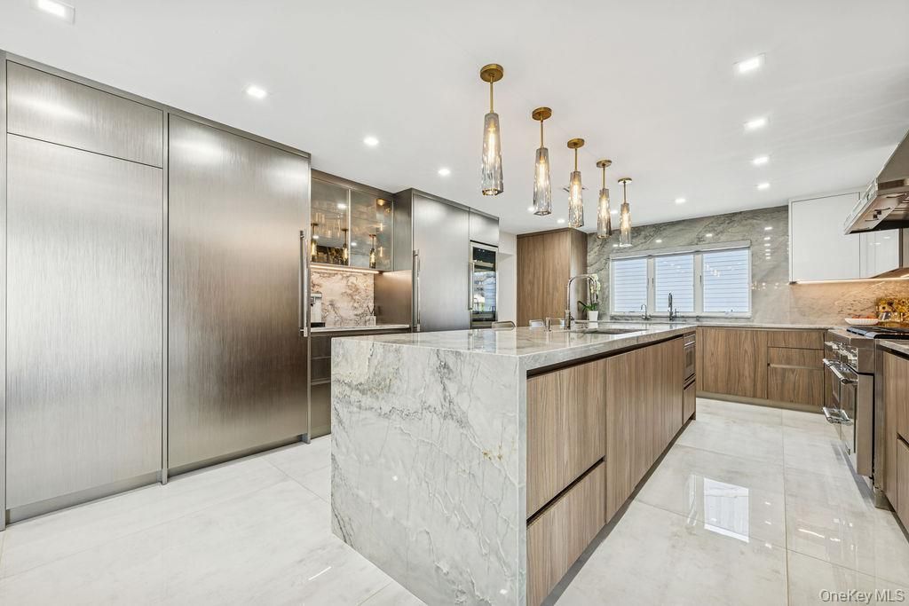 Interior, Kitchen, Marble Walls, Pendant Lights, Recessed Lighting, Stainless Steel Appliances