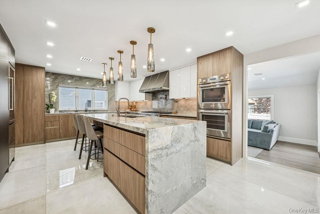 Interior, Kitchen, Marble Walls, Pendant Lights, Recessed Lighting, Stainless Steel Appliances