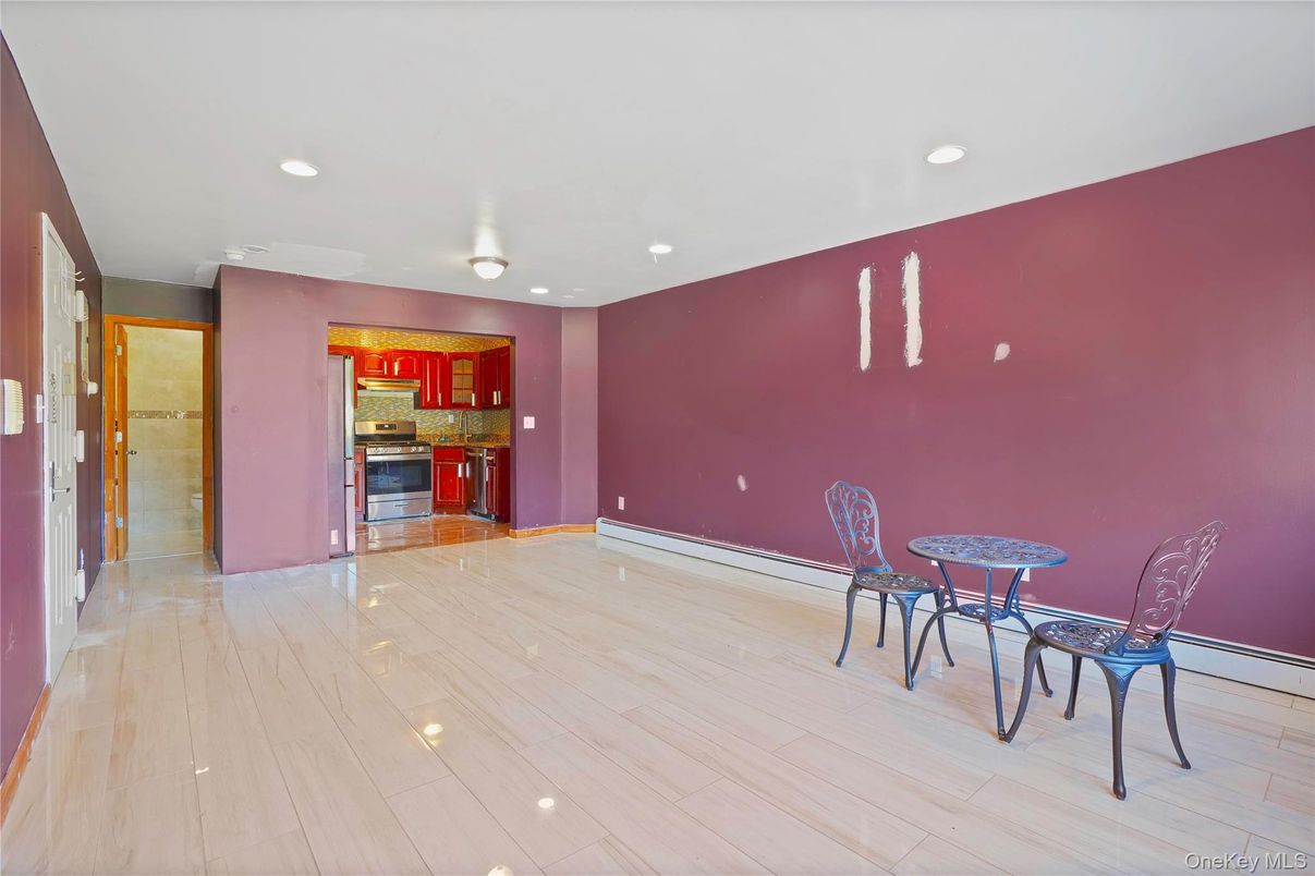 Dining room, Empty room, Interior, Kitchen, Recessed Lighting, Stainless Steel Appliances, Wood Texture Flooring