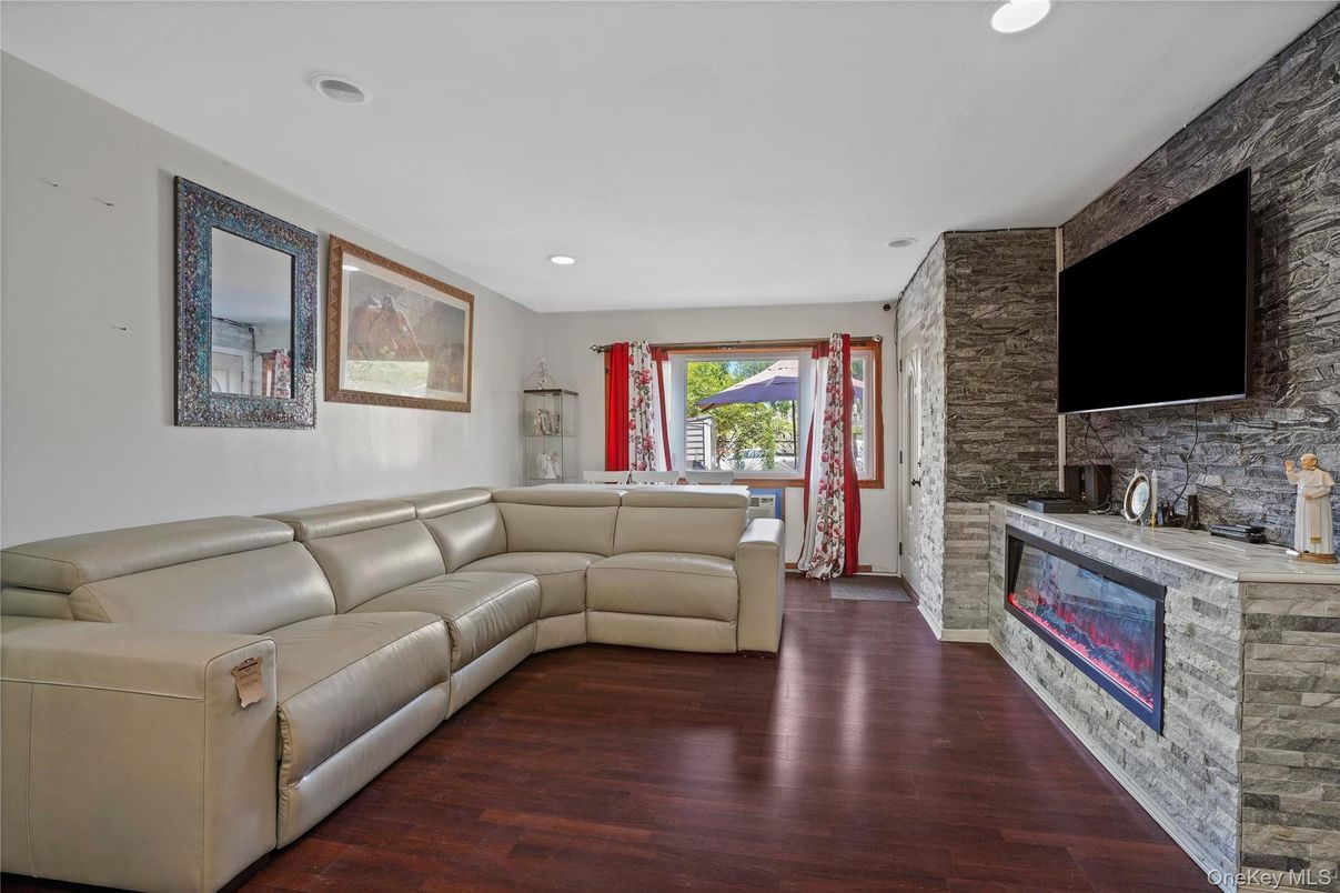 Fireplace, Interior, Living room, Recessed Lighting, Stone Walls, Wood Texture Flooring