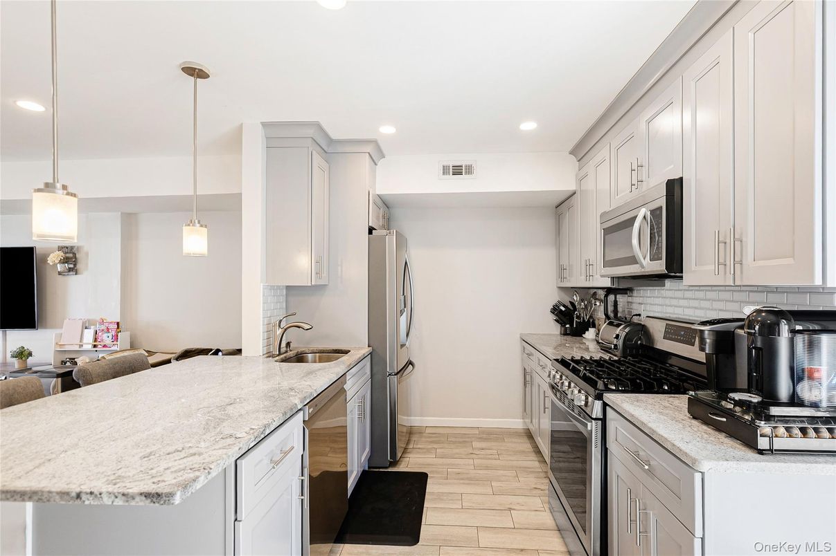 Interior, Kitchen, Pendant Lights, Recessed Lighting, Stainless Steel Appliances, Wood Texture Flooring